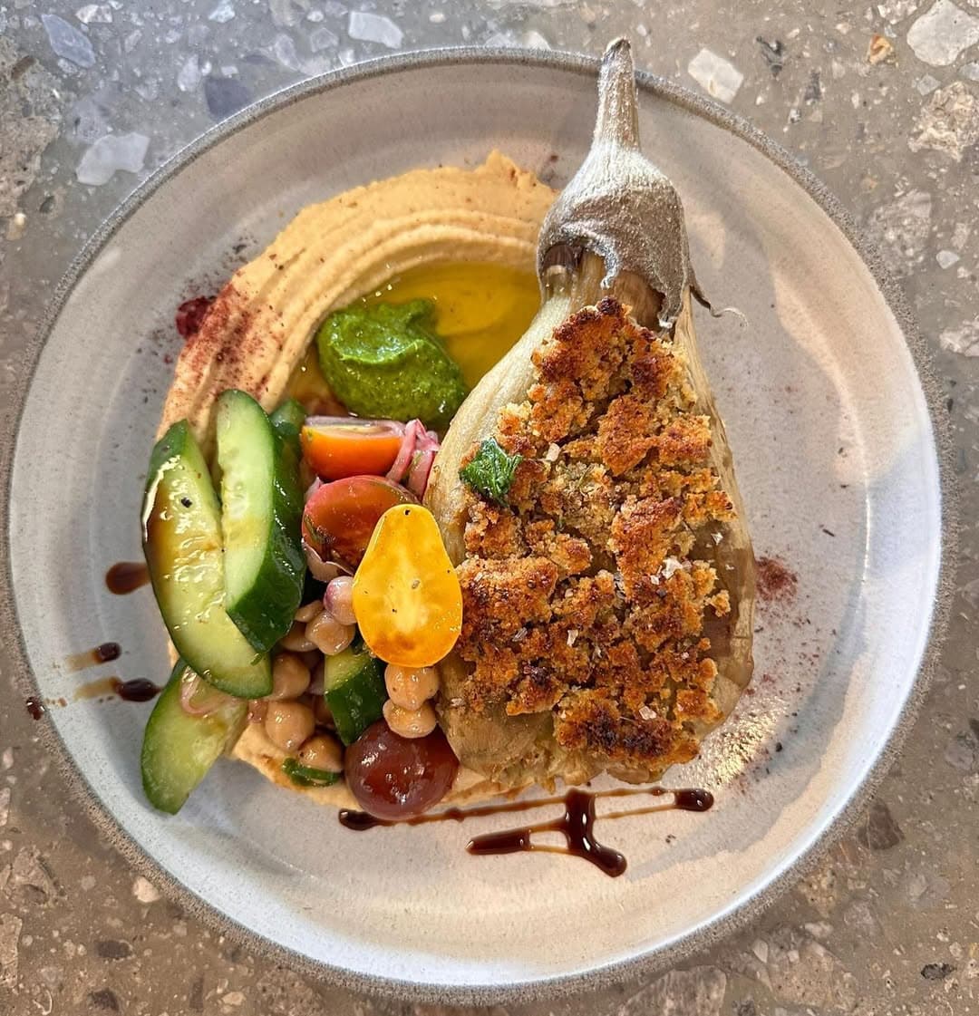 Stuffed aubergine on hummus