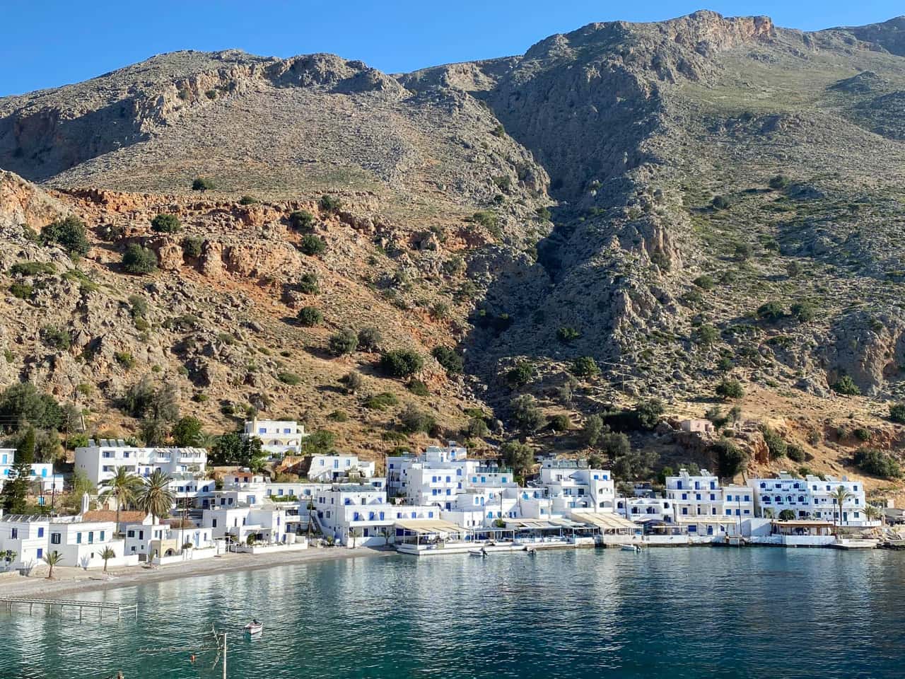 Loutro village with white houses and cliffs