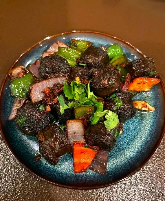 Plate of Nepalese sausage and vegetables 