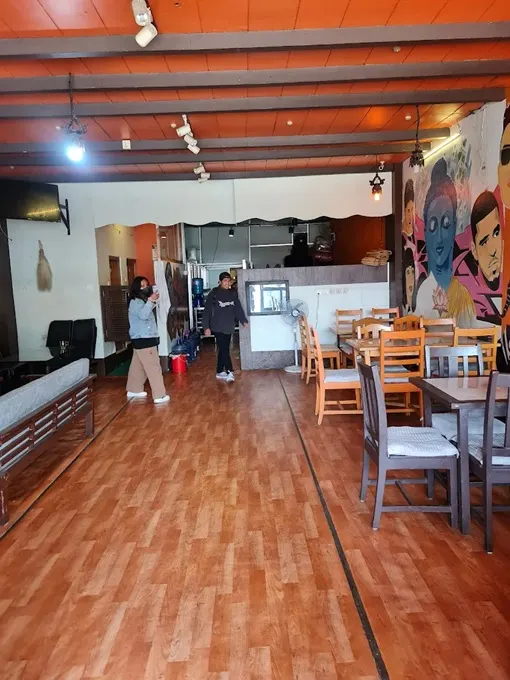 Interior of a restaurant in Pokhara with wooden tables and chairs