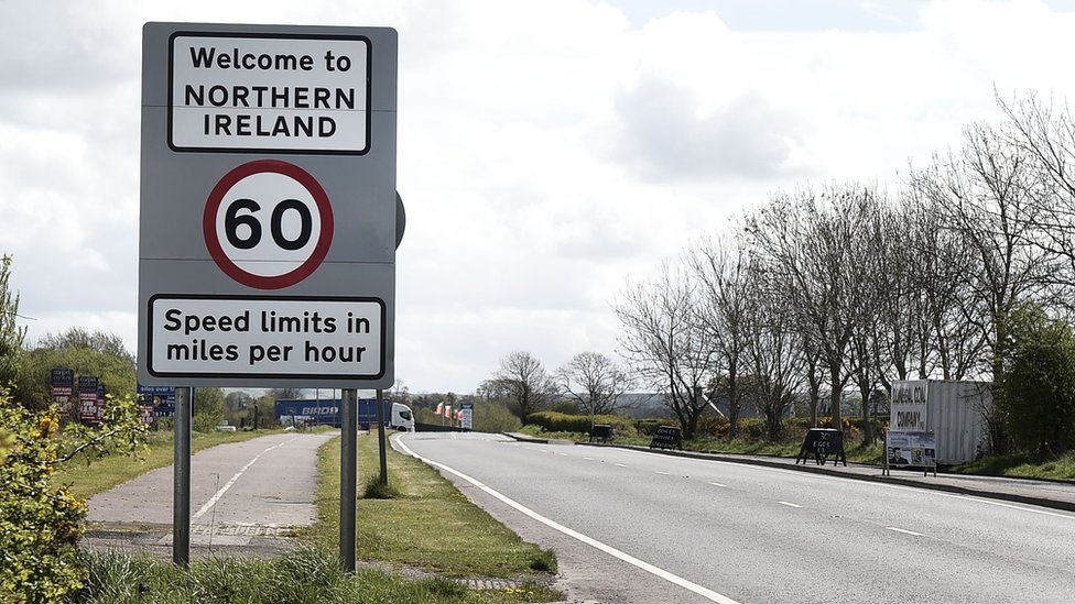 a road sign marks the border between the republic of ireland and northern ireland