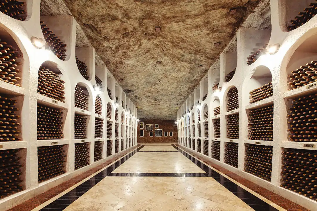 wine bottles in racks underground at cricova winery near chisinau moldova