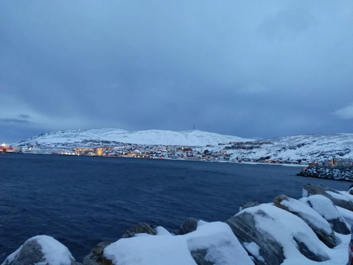 midnight sun over hammerfest harbour norway
