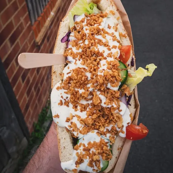 kynsza is a polish street food similar to doner kebab with pita bread meat vegetables and sauce