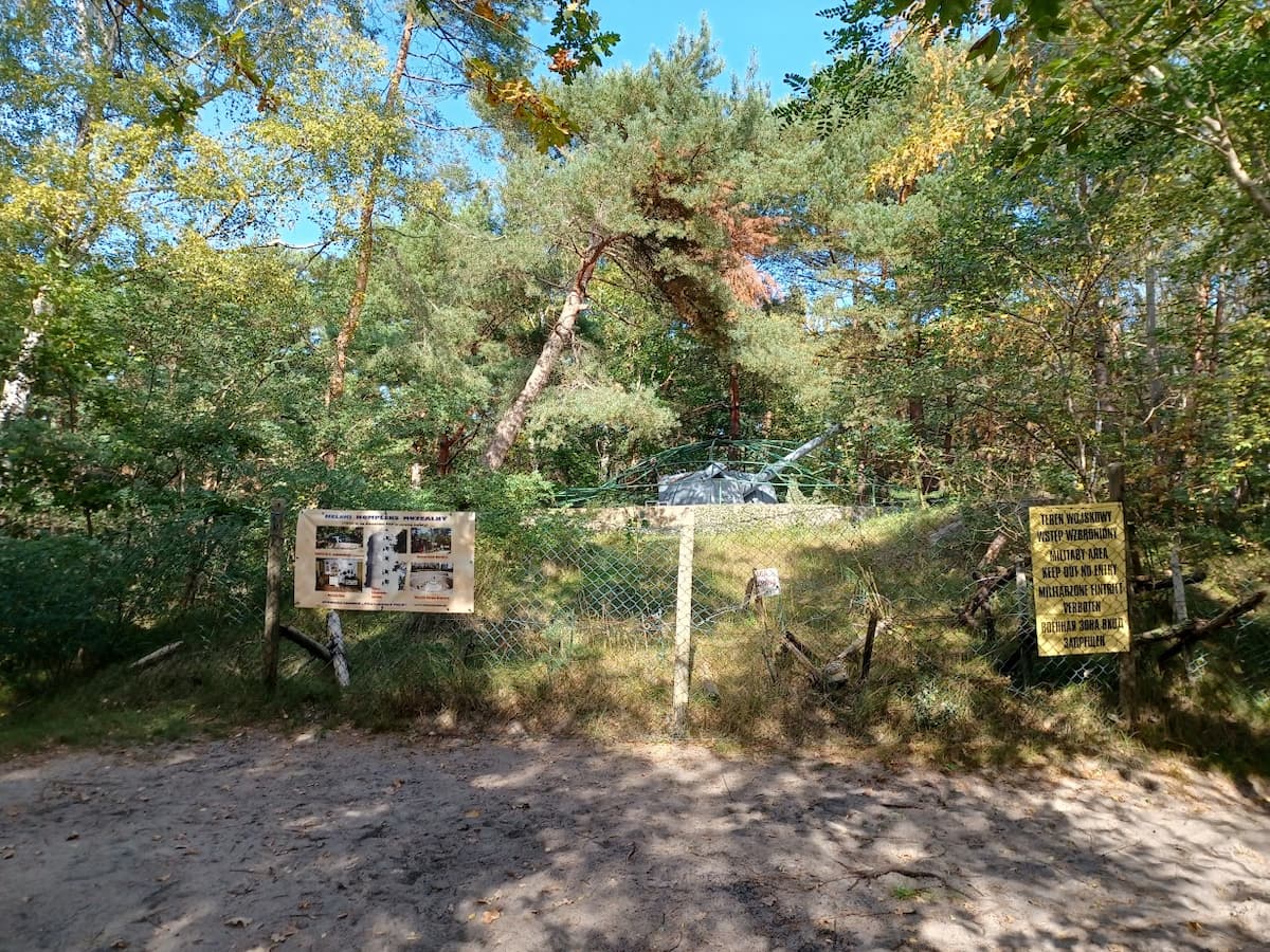 a tank behind wire in woodlands in hel poland