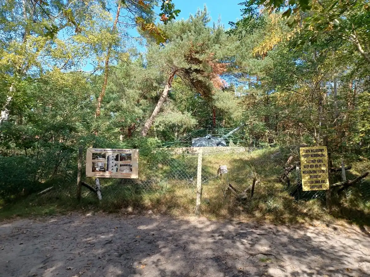 a tank behind wire in woodlands in hel poland