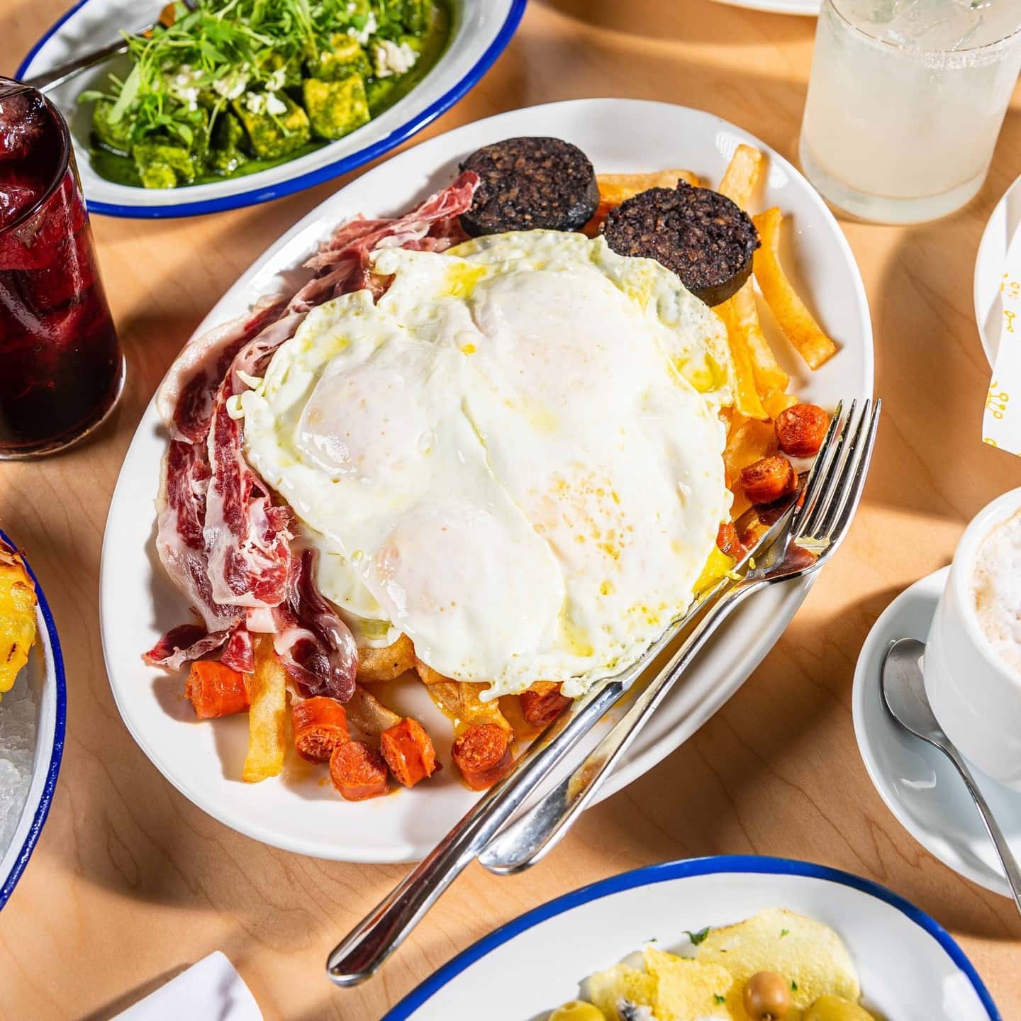 Some restaurants also serve Huevos rotos with black pudding