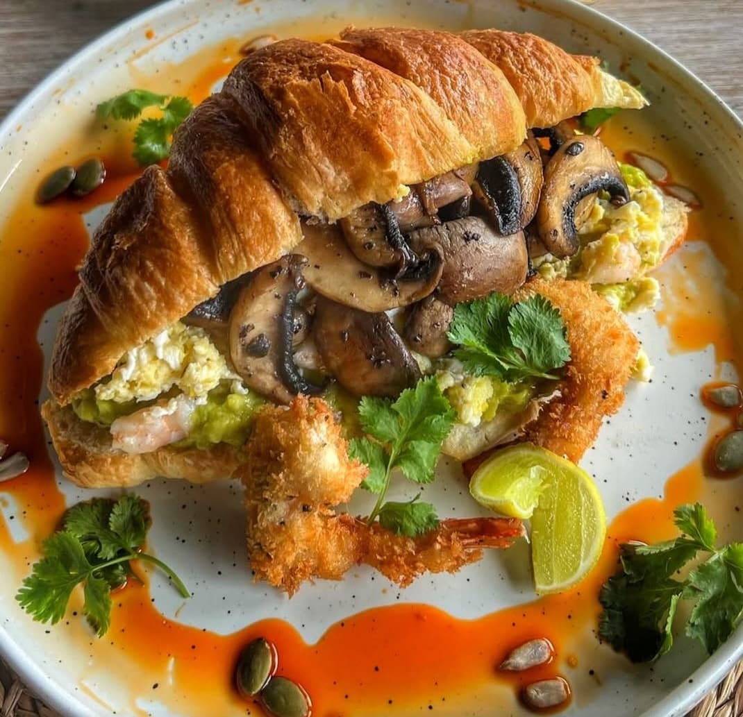 Scrumptious mushroom and tempura prawn croissant