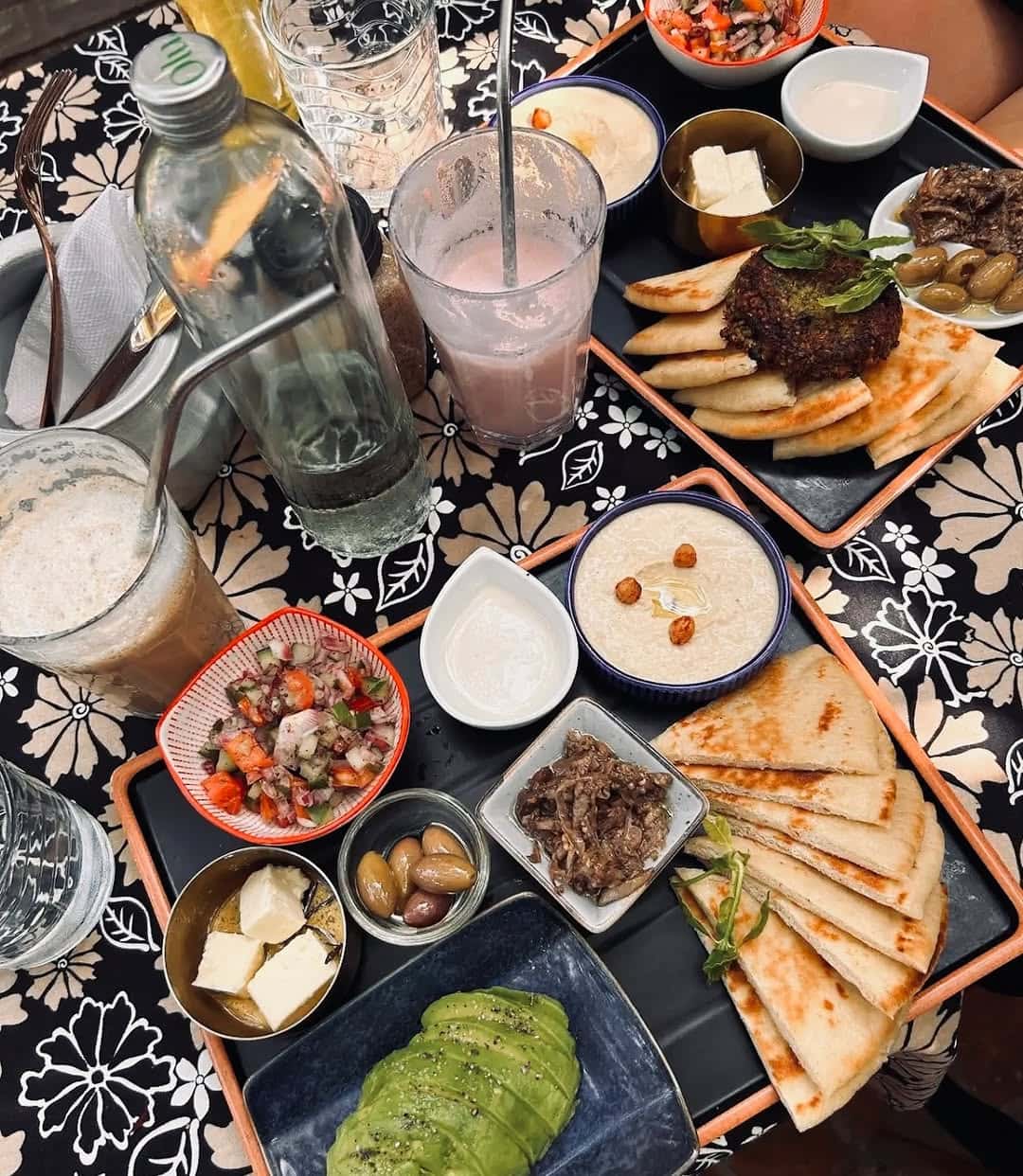 Mezze style bites including olives and pita breads