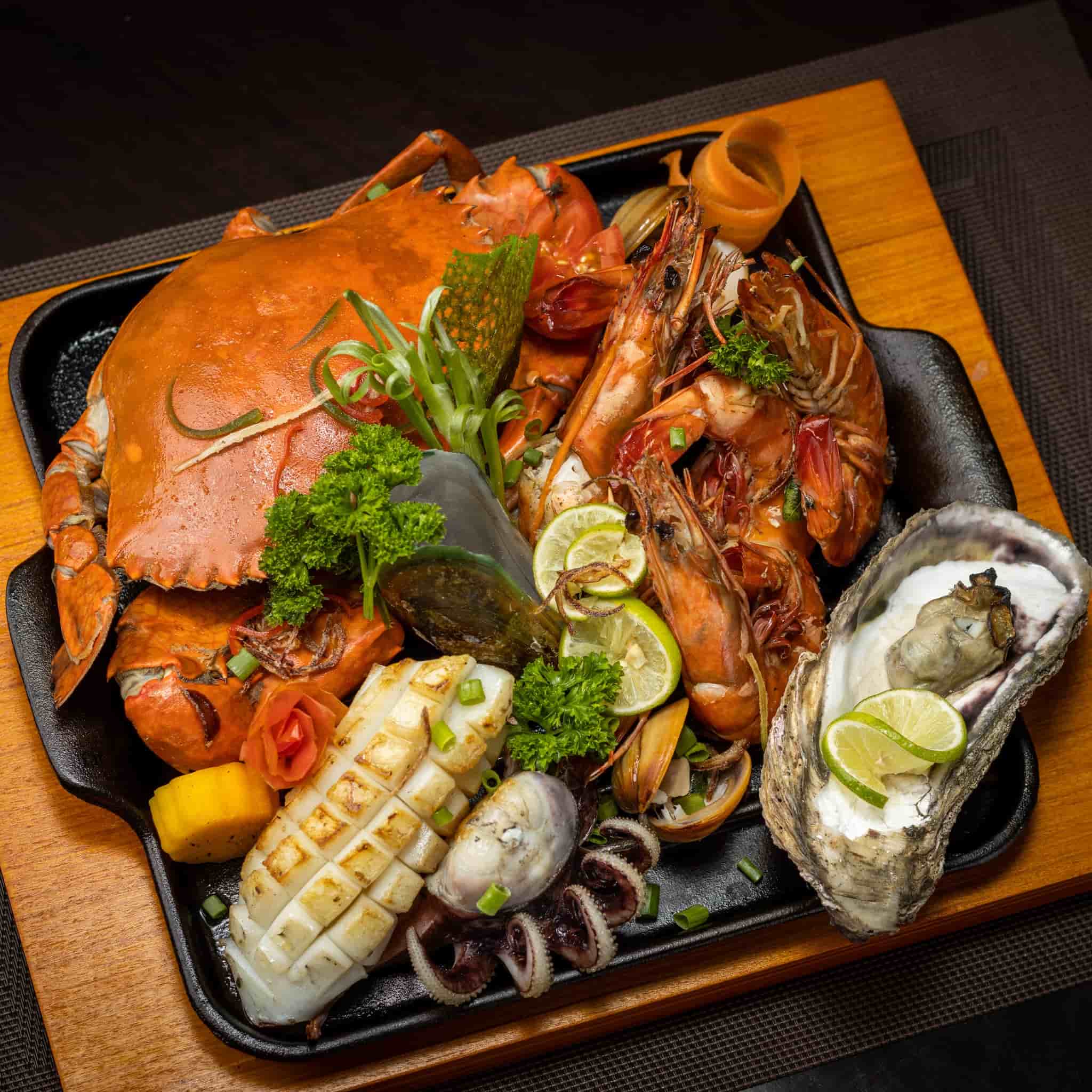 Impressive seafood platter with crab, squid, prawns, oysters