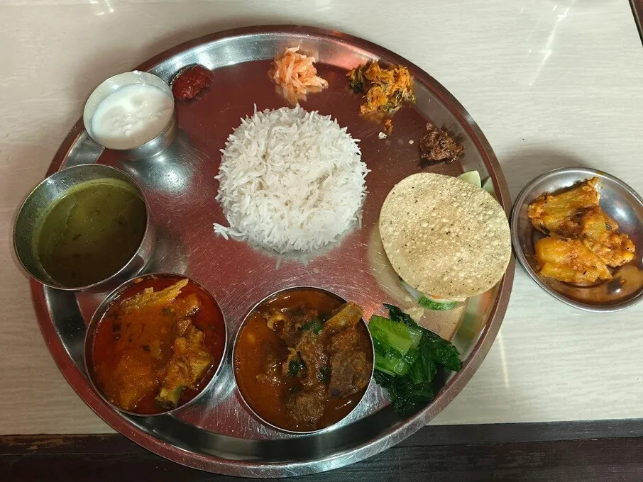 Nepalese thali meal set with assorted curries