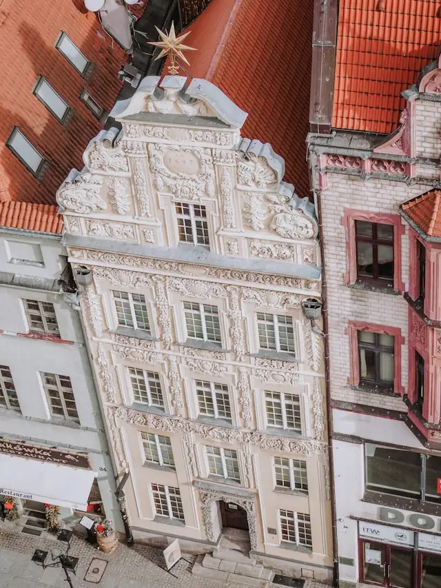 a tall medieval townhouse in the old town of torun poland