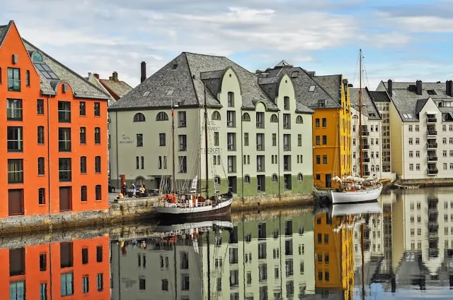 colorful art nouveau buildings on alesund waterfront in norway