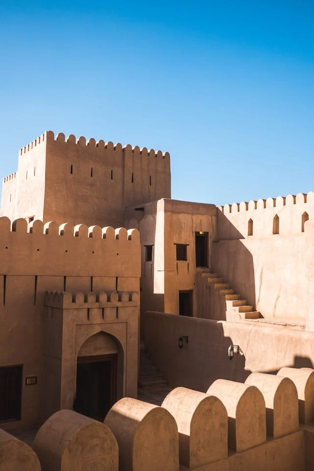 the stone walls of an ancient fort in nizwa oman