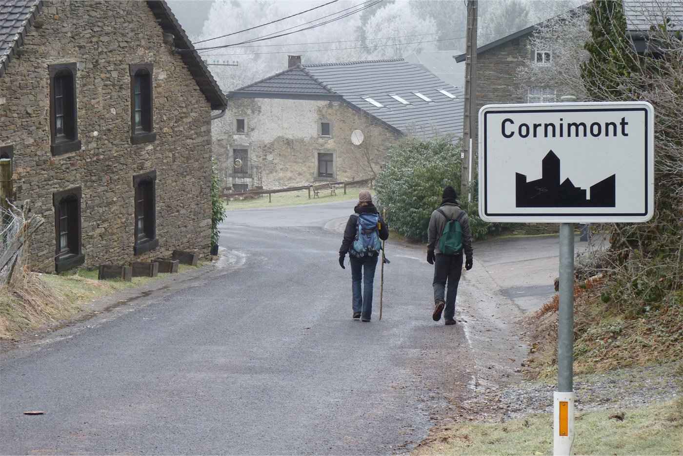 A street in Cornimont with two people walking on it
