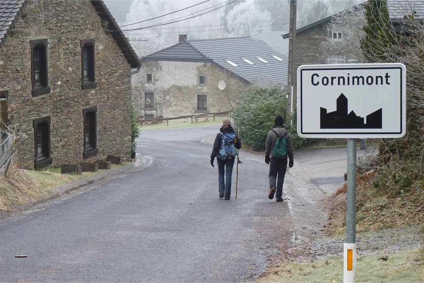 A street in Cornimont with two people walking on it