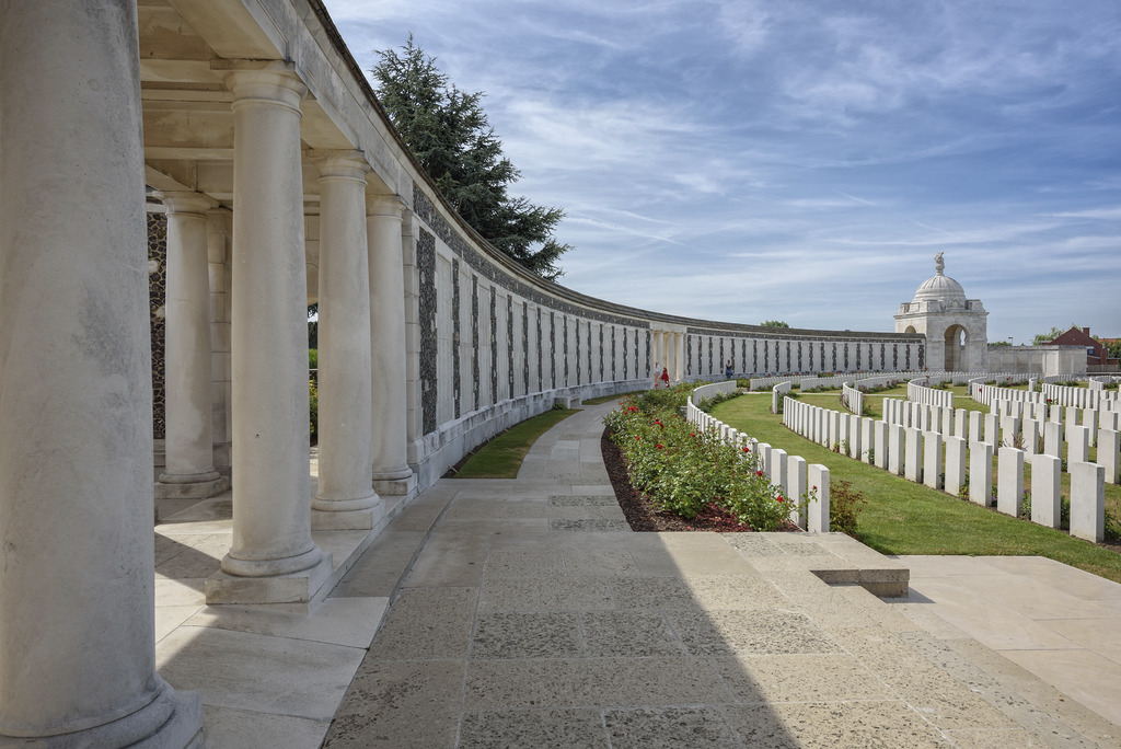 white headstones and a world war one memorial at tyne cot cemetery near ypres in flanders fields belgium