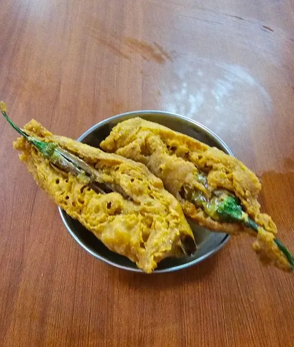 Chili fritters on a metal plate in Goa