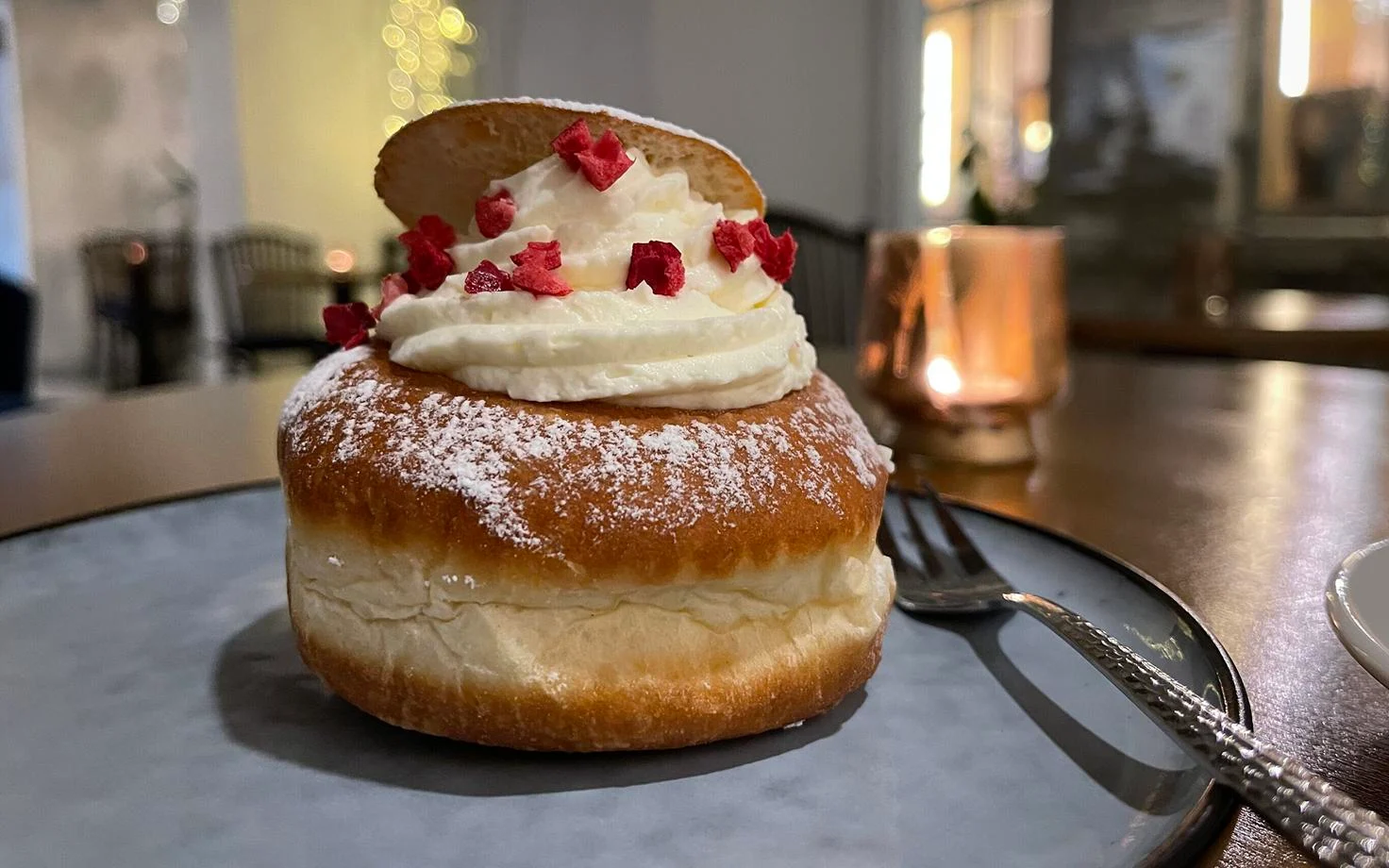 vastlakukkel are sweet buns topped with cream a popular traditional estonian food