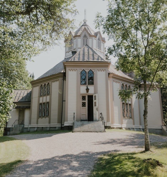 The beautiful white church of Strömfors seen from the front