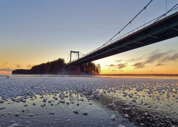 A bridge and island seen from the wintery lake