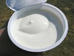 a tub of skyr yoghurt from iceland with the foil lid pulled back