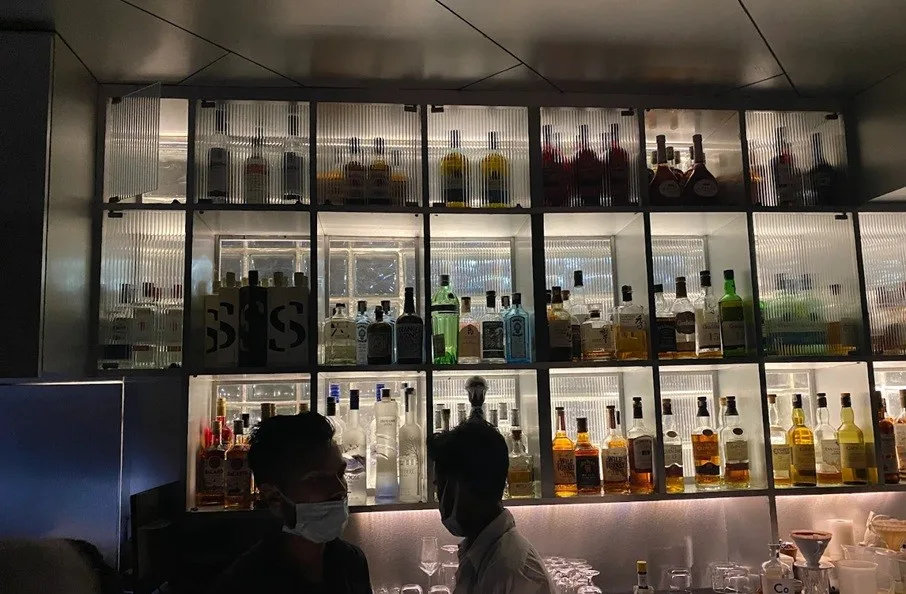 Alcohol bottles behind the bar area