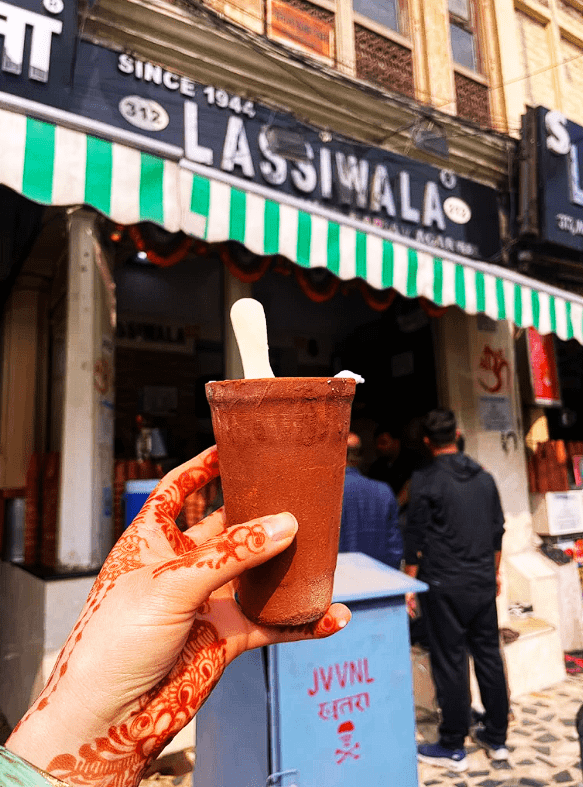 Clay cup of lassi in front of a famous lassi vendor 