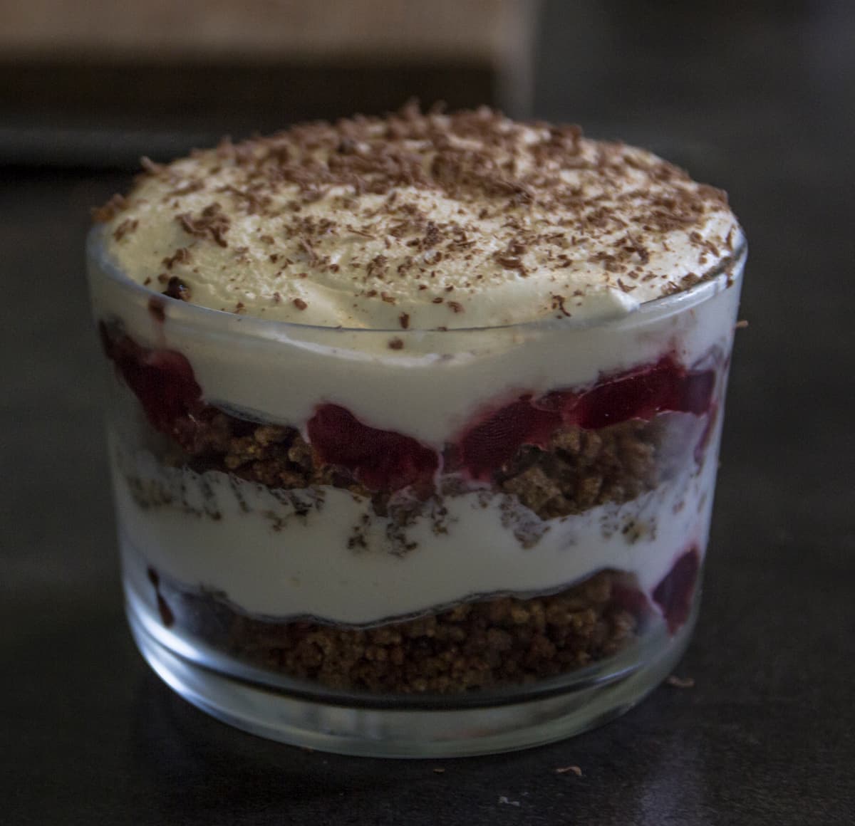 a glass containing a latvian rye bread soup which is layered like a trifle 
