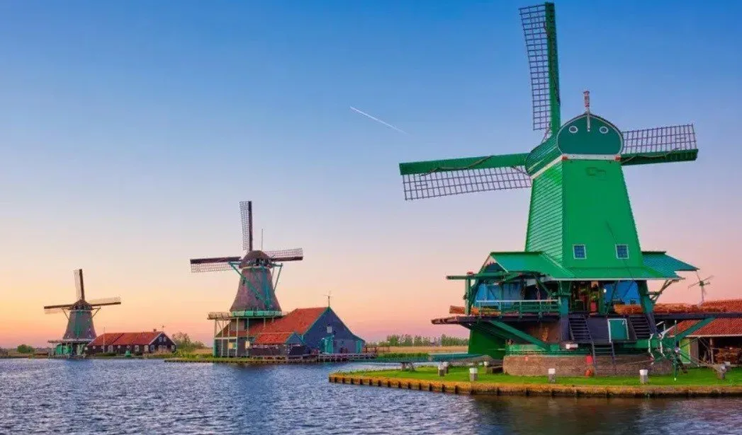 Windmills by a canal