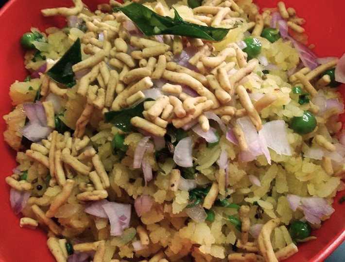 Bowl of poha with sev