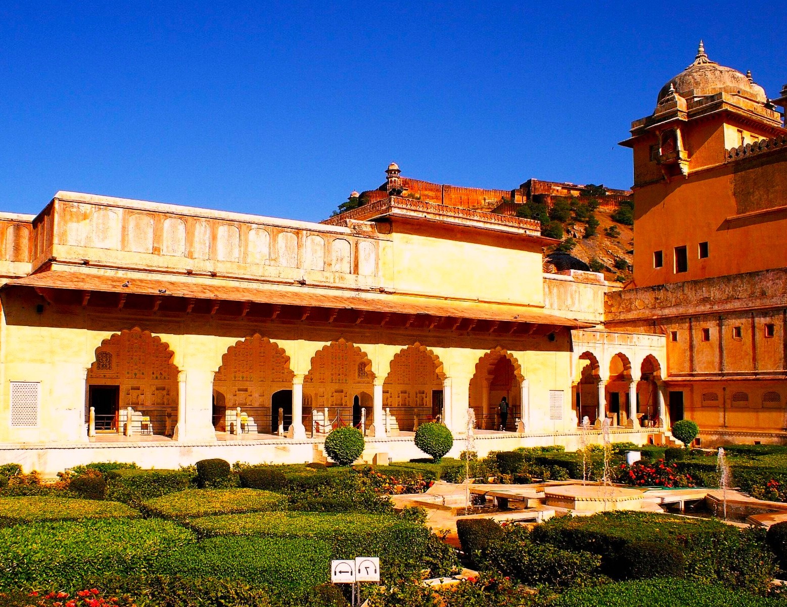 Palatial fort overlooking a green garden 