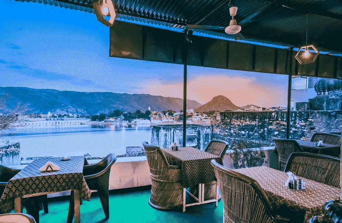 Restaurant terrace seating overlooking a lake 