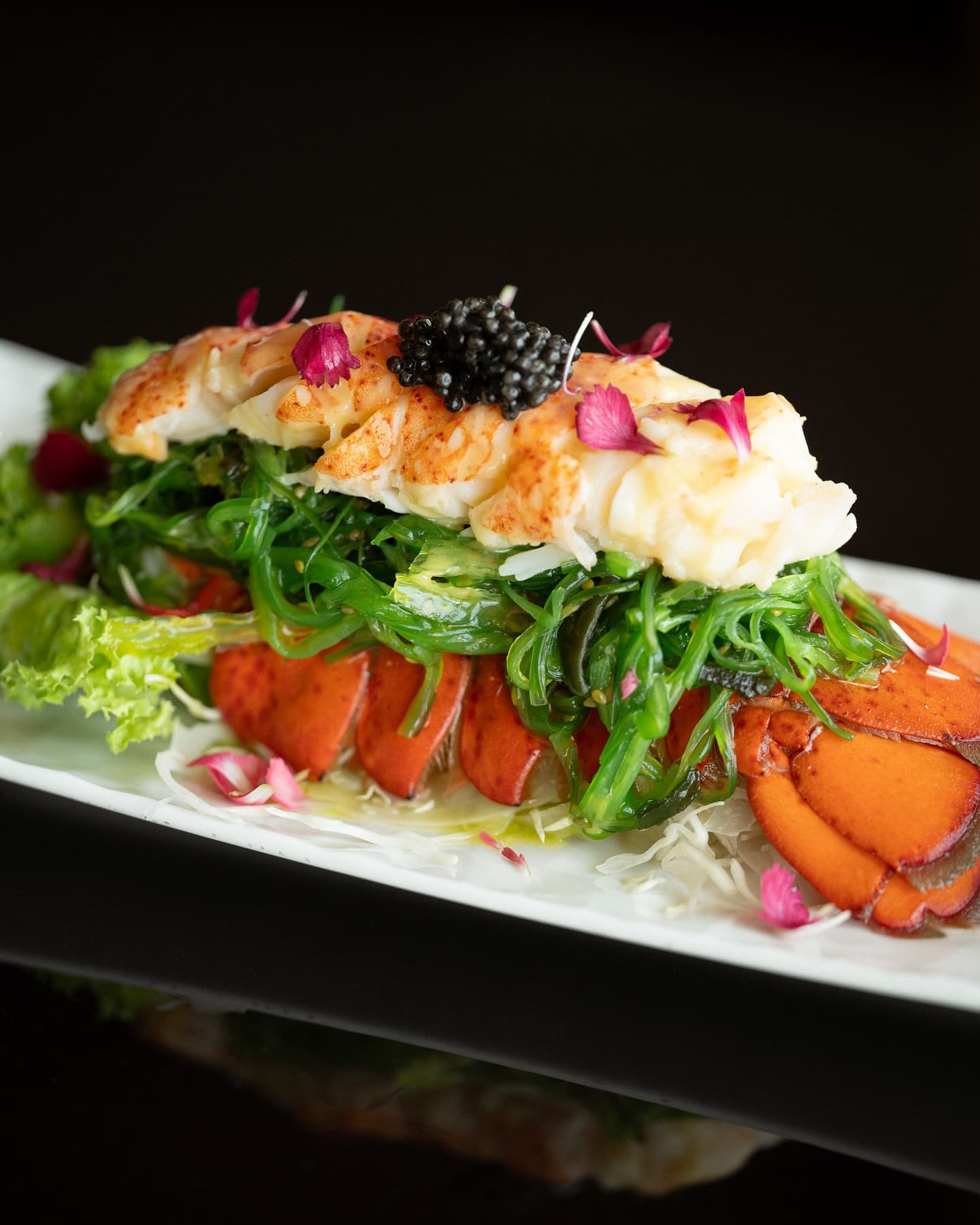lobster on a bed of hiyashi wakame seaweed salad from sky lounge restaurant at the hilton hotel belgrade serbia