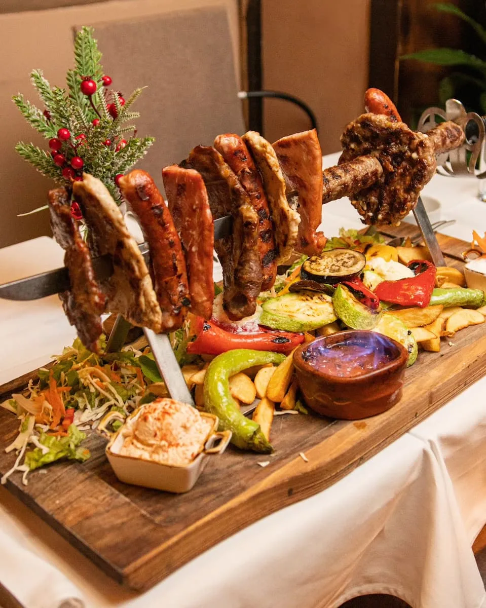 a mixed grill for two of cevapi, sausage, chicken, fritters and pork from velika skadarlija restaurant in belgrade serbia