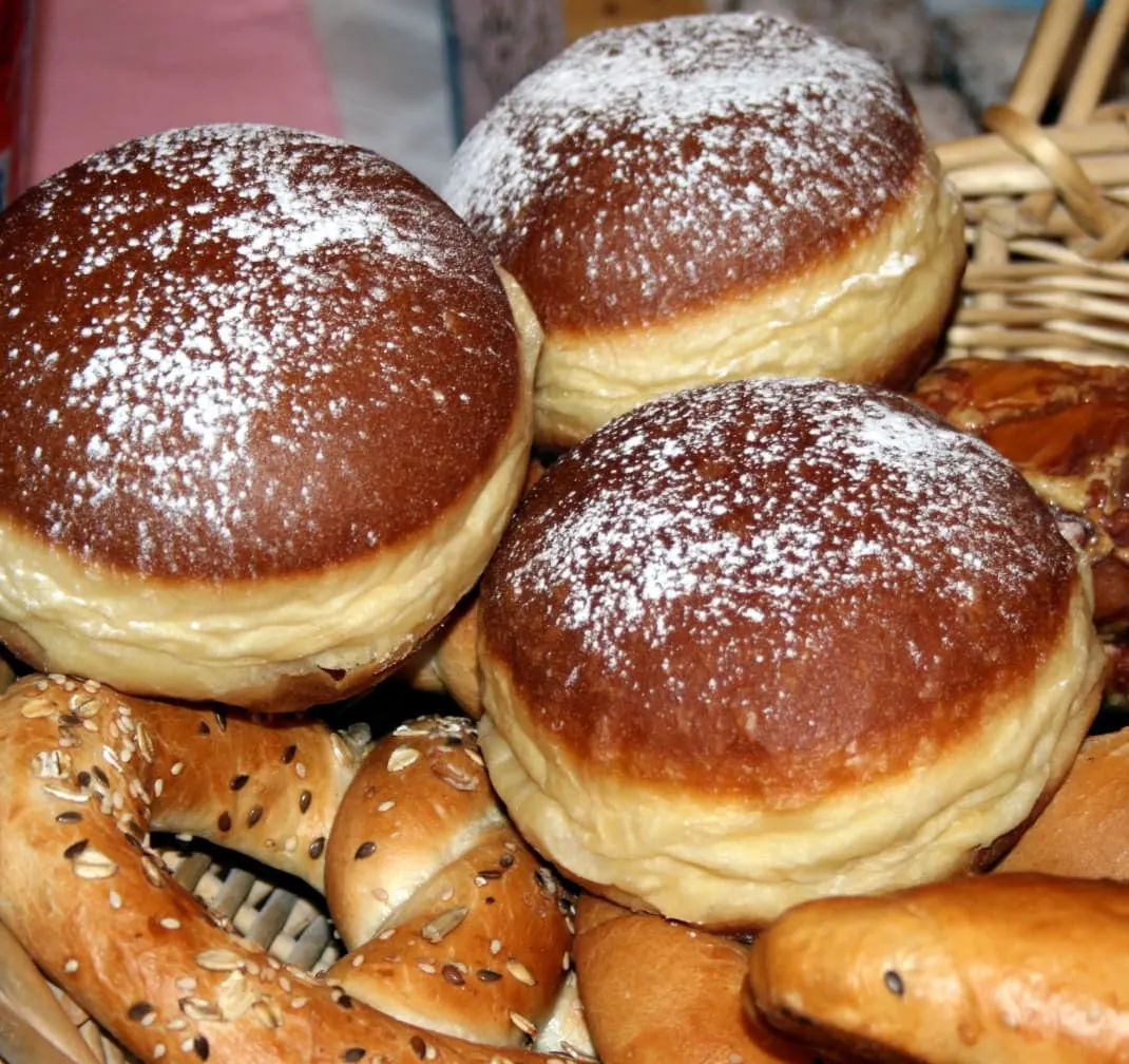 traditional serbian krofne donuts topped with a sprinkle of icing sugar