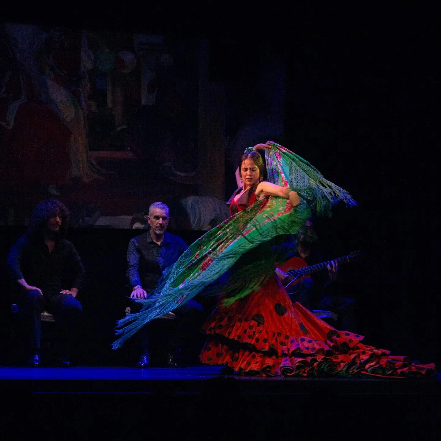 A flurry of flamenco costumes as the dancer performs on stage