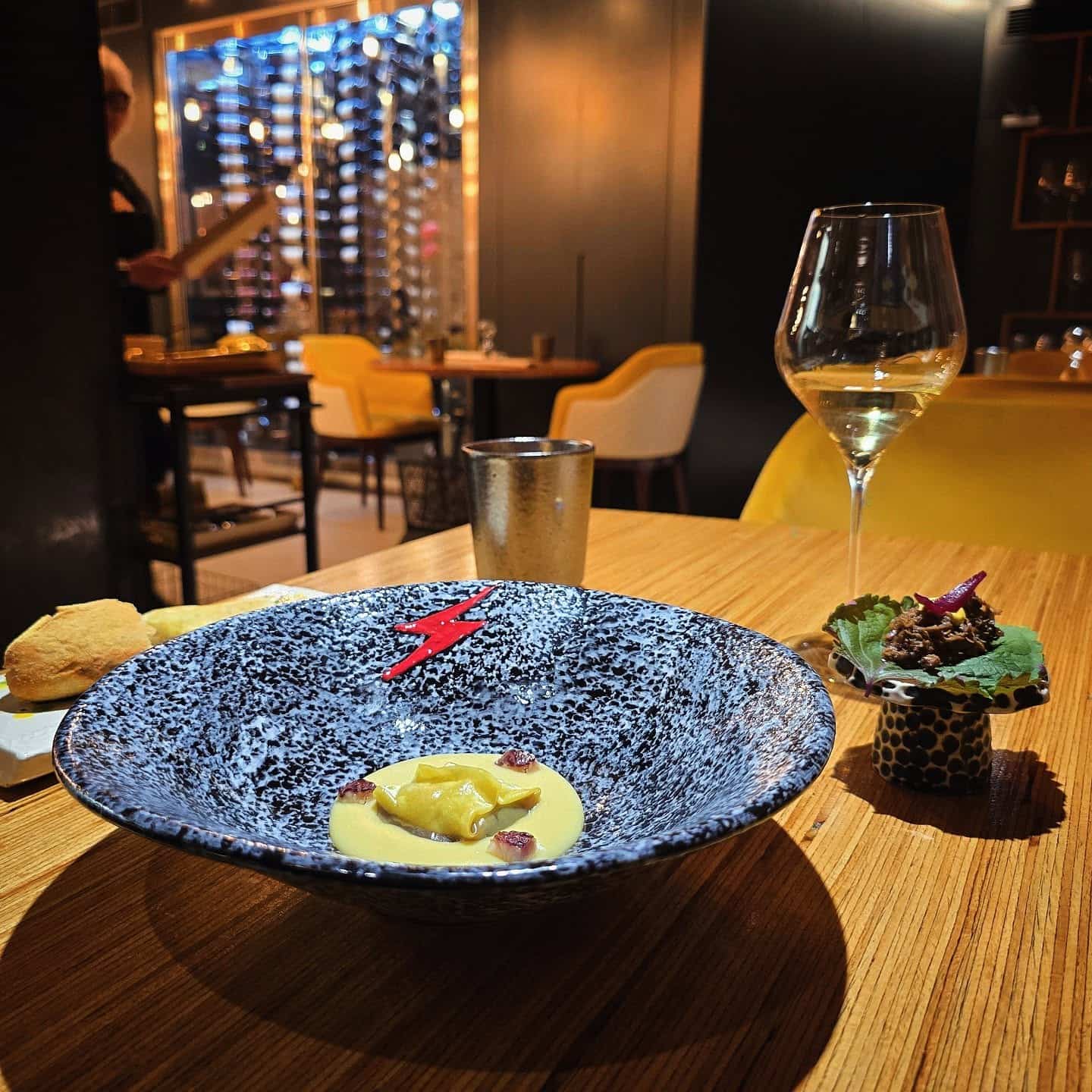 Custom-made servingware with the restaurant's signature lighting strike logo