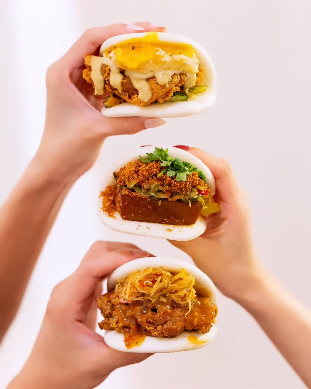 Classic and Western bao buns wirth pork and crispy deep fried chicken