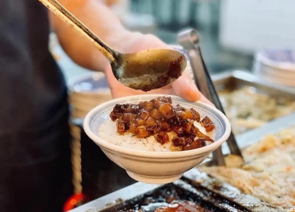 This dish comprises sticky pork belly and served with rice