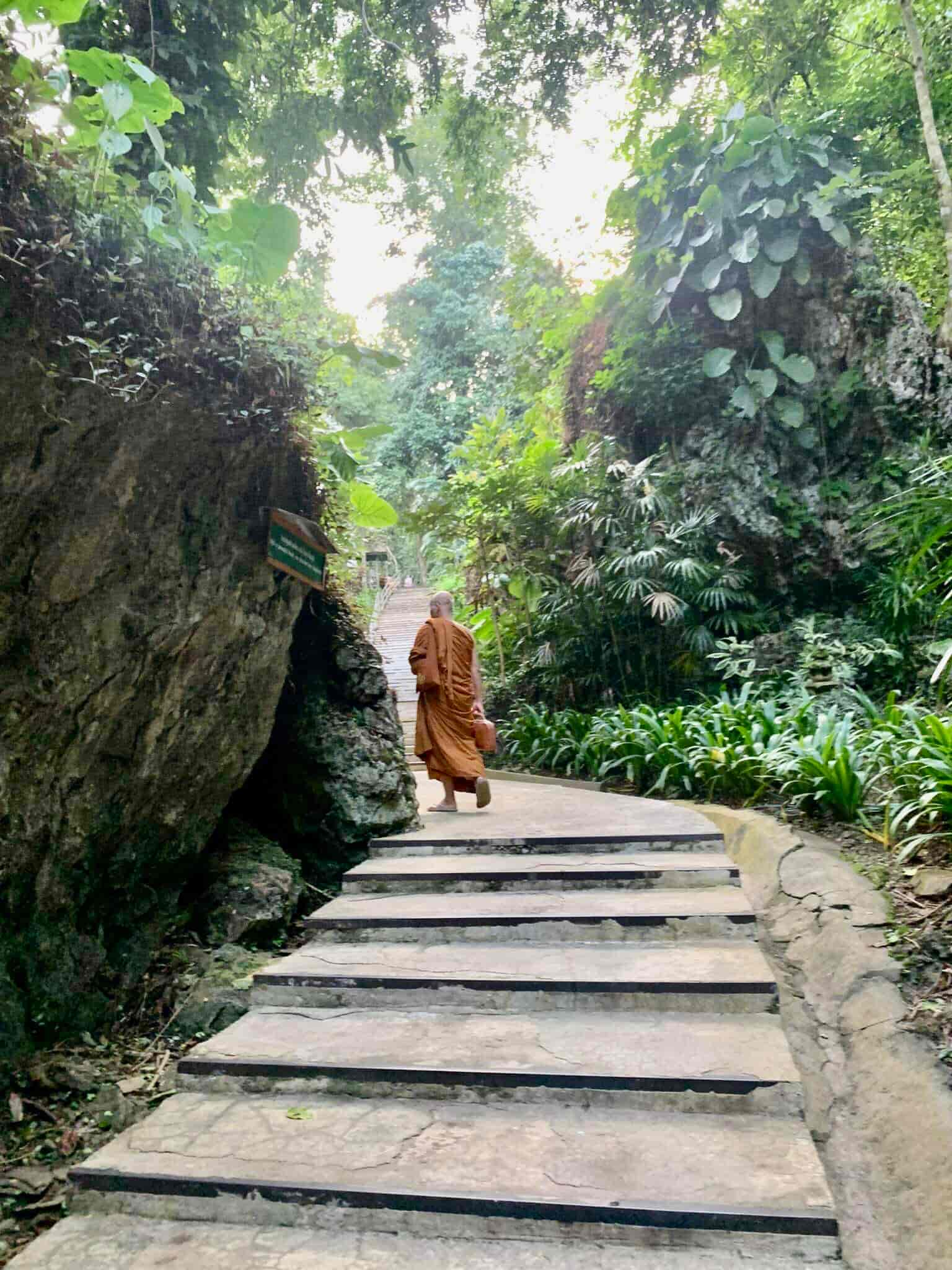 A monk walking 500 steps to the temple in Chiang Dao
