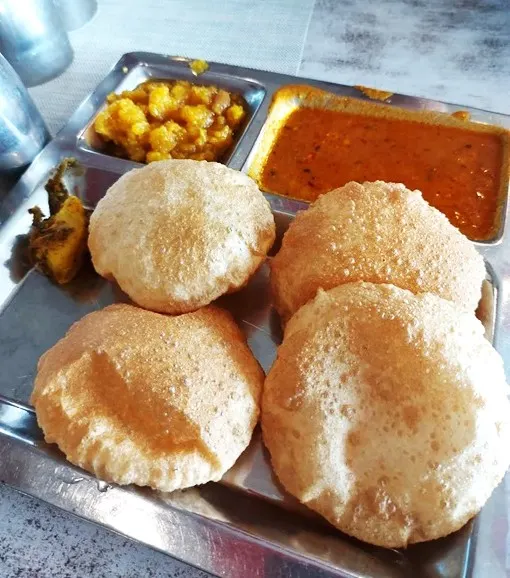 Plate of Indian fried flatbreads with chickpeas