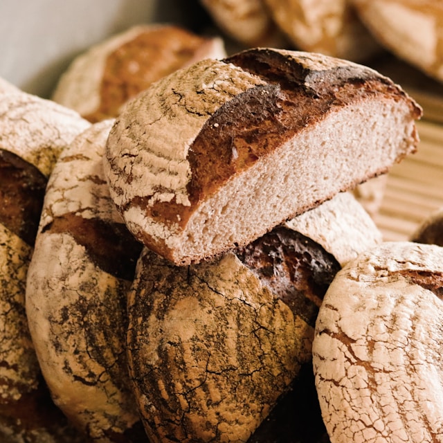 a loaf of rye bread sliced in half