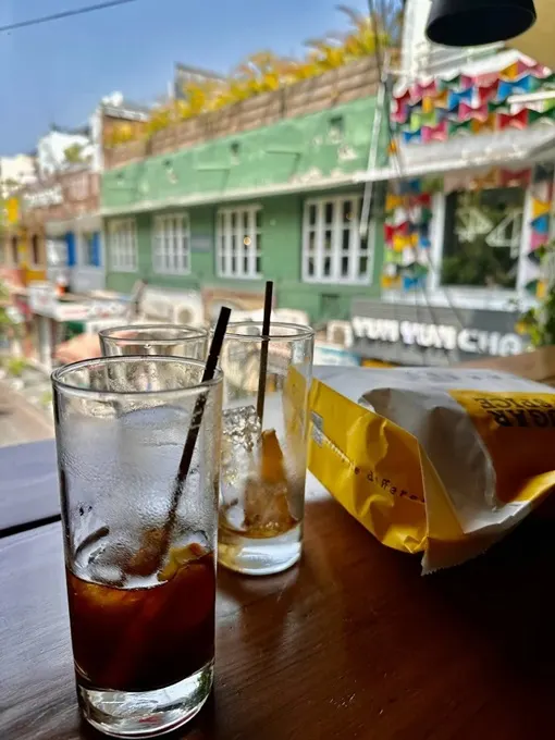 Drinks on a window facing table  