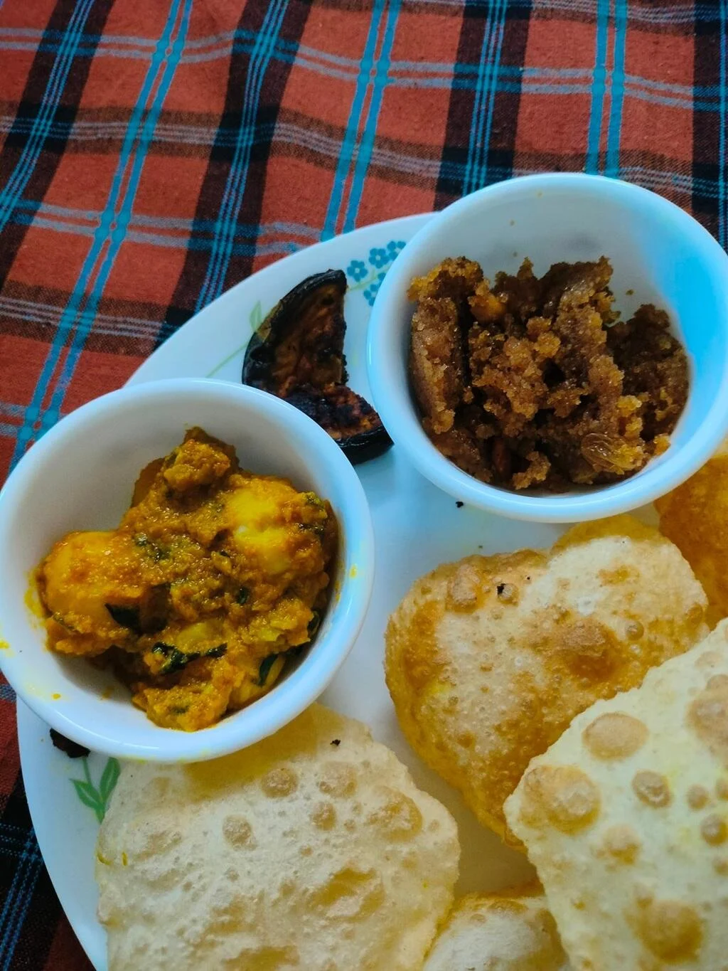 Plate of fried flatbreads and potato curry