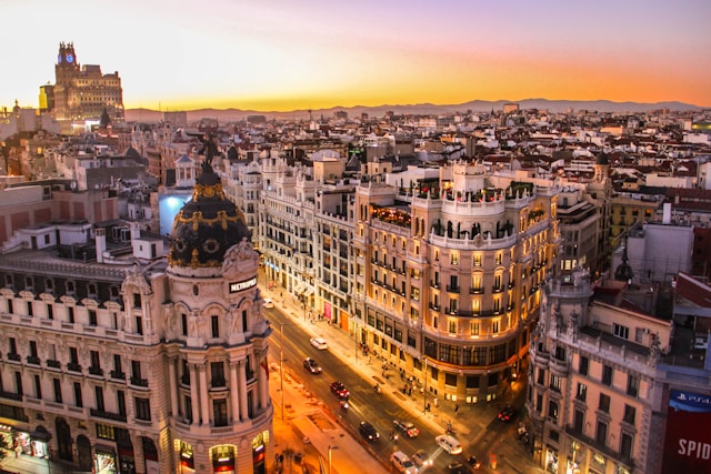 sunset over historic stone buildings in madrid spain the starting point of an epic 2 week europe by train itinerary