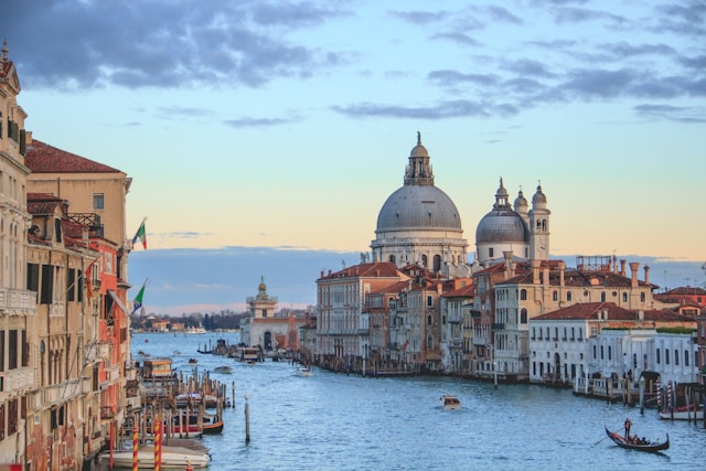 the grand canal in venice with basilica santa maria della salute in the background