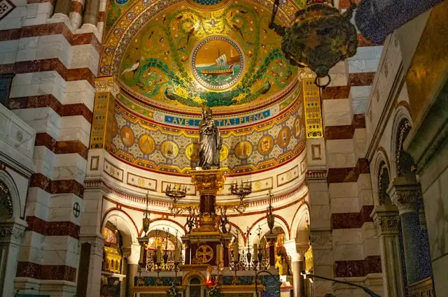 dome art and an altar in the notre dame cathedral marseille france