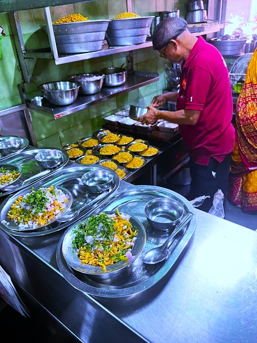 A tea stall serving Indian breakfast foods 