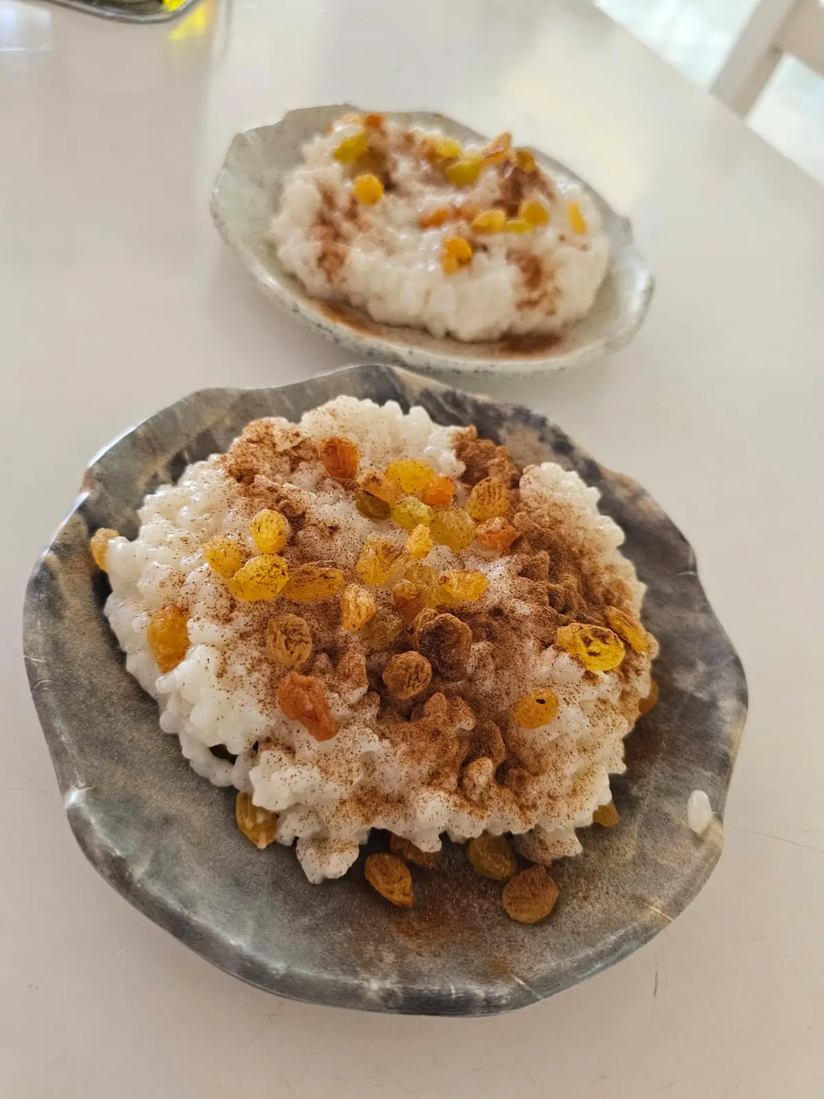 a bowl of sultjash an albanian rice pudding at sophra restaurant in sarande albania